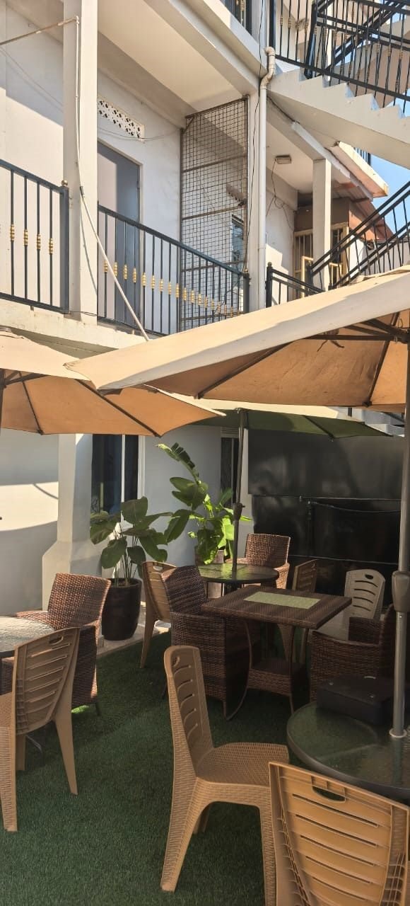Outdoor garden lounge and sitting area at KAA Highway Hotel Mukono